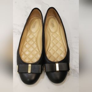 Michael Kors ballet flats black with gold accents.